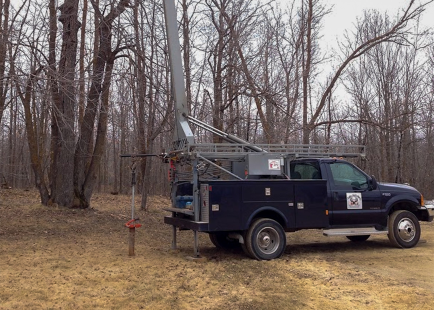 pump hoist on back of Antler's Well Drilling truck